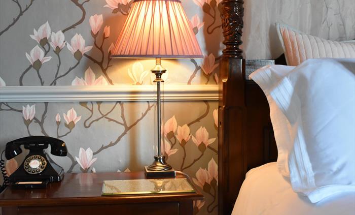 Our most spacious double room, decorated in creams and golds and featuring a 7ft four-poster bed. Step down into the ensuite bathroom which is fitted